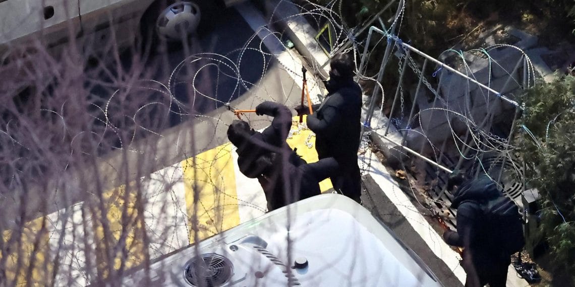 Investigators scale barbed wire to arrest South Korea’s impeached president